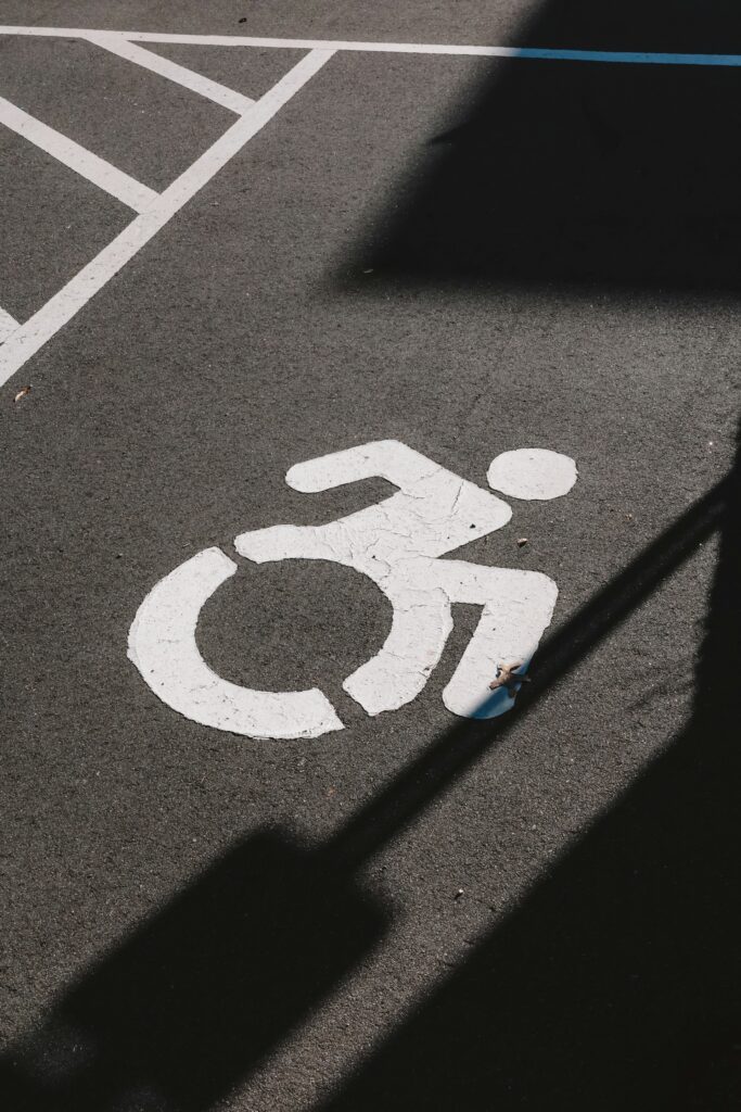 Picture of a handicap accessible sign on a parking spot.