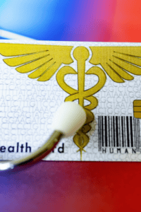 A close up of a health card and a stethoscope
