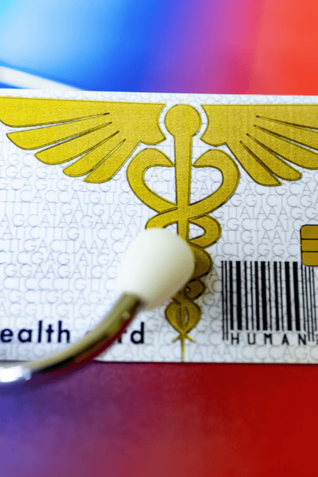 A close up of a health card and a stethoscope